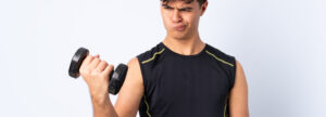 a man holding a dumbbell