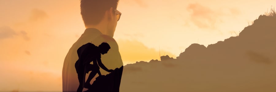a man climbing a mountain