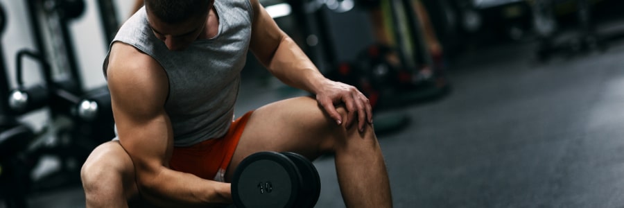 a man lifting weights in a gym