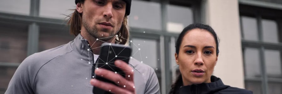 a man and woman looking at a cellphone